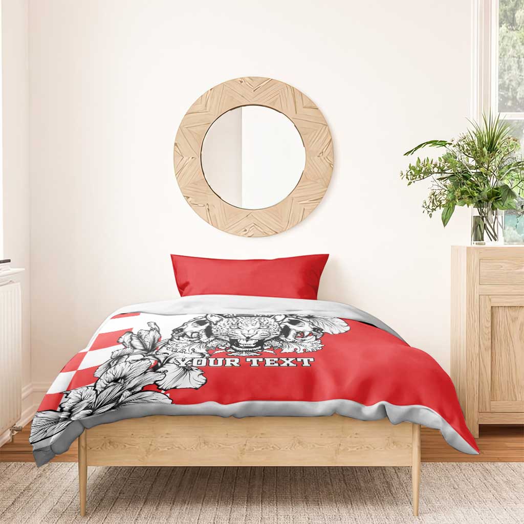 Red bedding set with leopard heads and floral graphic on duvet, showing red pillowcase and “YOUR TEXT”