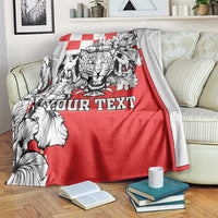 Croatia leopard heads blanket draped on couch, red/white/black lion heads and 'YOUR TEXT'