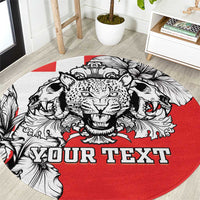 Personalized round rug with black-and-white animal head graphic and red field, 'YOUR TEXT'