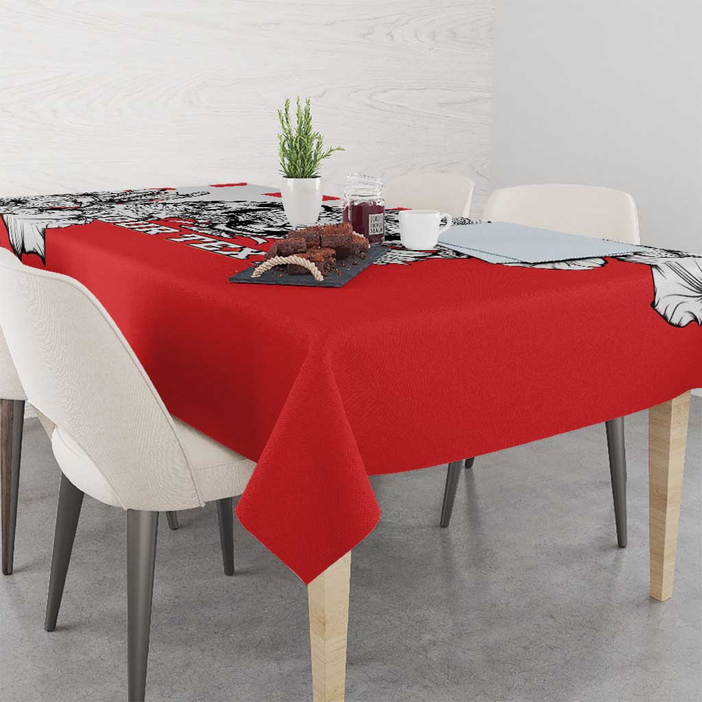 Red dining tablecloth with black-and-white leopard head print and scalloped corner drape