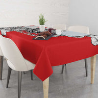 Red dining tablecloth with black-and-white leopard head print and scalloped corner drape