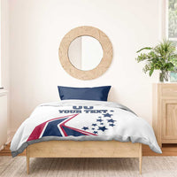 White bedding set with two navy pillowcases; comforter shows stars, flag graphic, and 'YOUR TEXT'