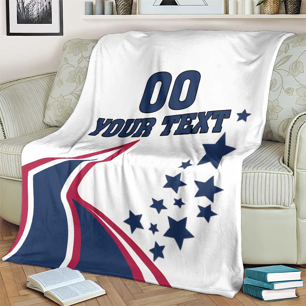 White USA-themed blanket on armchair with stars and “YOUR TEXT” plus “00” graphic
