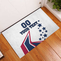 White rubber doormat with custom text, stars, and red/navy flag-like design