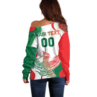 Women’s off-shoulder sweater with green, white, red tri-color print and large text.