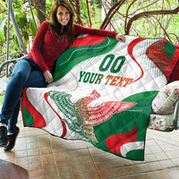 Mexican flag quilt blanket with “00 YOUR TEXT” and eagle graphic, draped over seated person