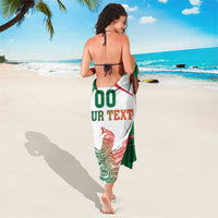 Mexico-themed white sarong with eagle emblem and 'YOUR TEXT' text, draped to ankles