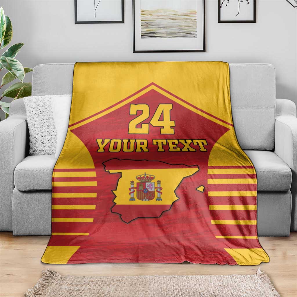 Spain-themed sports blanket draped on a sofa: red/yellow with coat of arms map, 24 and Your Text