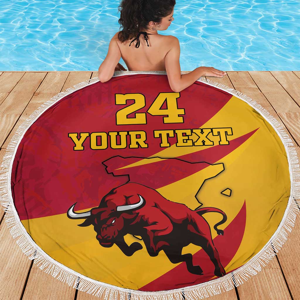 Red and yellow round beach blanket with white fringe, bull artwork, and “YOUR TEXT” text.