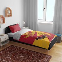 Red and yellow duvet with bull graphic, “24” and “Your Text,” on bed with one set of pillows