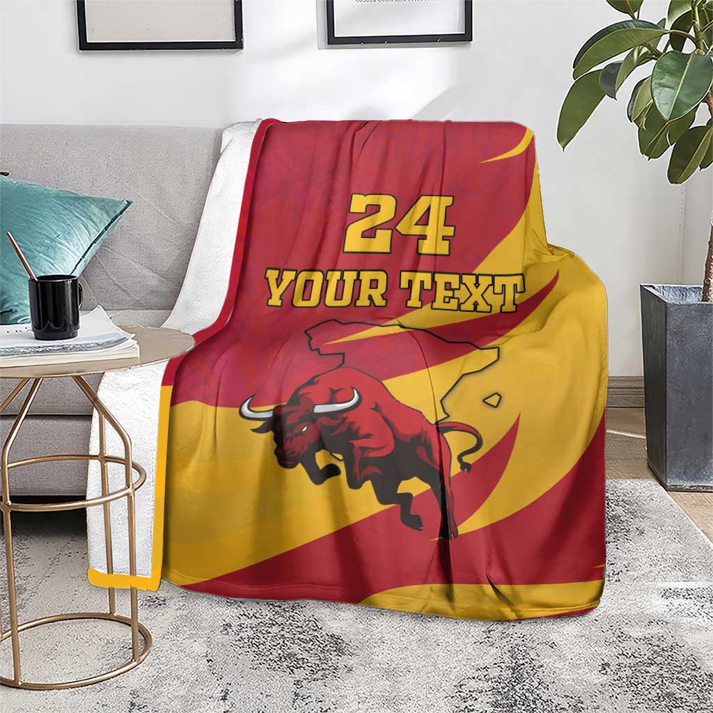 Spain flag-style bull blanket on chair, red and yellow, "24 YOUR TEXT" print