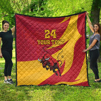 Red and yellow quilt blanket laid out flat with bull graphic and '24 YOUR TEXT'