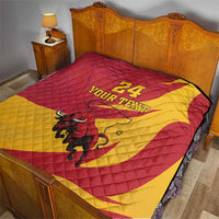 Red and yellow quilt blanket on bed with bull graphic and '24 YOUR TEXT' design