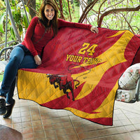 Red and yellow quilt blanket draped over outdoor seating with bull graphic and '24 YOUR TEXT'