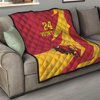 Red and yellow quilt blanket on sofa with bull graphic and '24 YOUR TEXT' design