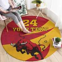 Round red and yellow rug featuring aggressive bull and '24 YOUR TEXT' text print