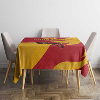 Red and yellow bull-themed tablecloth with geometric print and floral accents