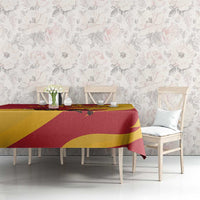 Red and yellow bull tablecloth with flower motifs, draped over dining table