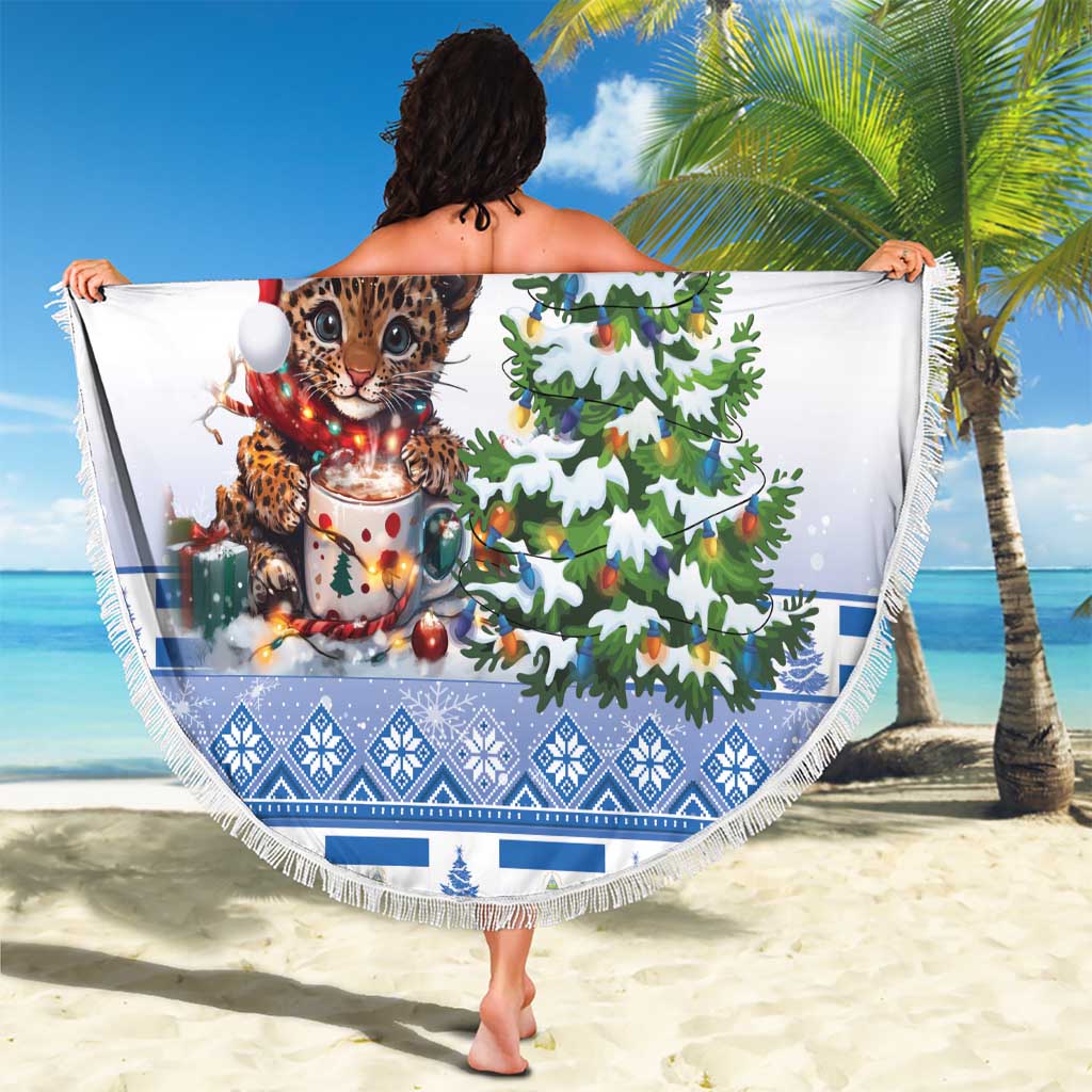 Round blue beach blanket with leopard kitten in Santa hat and Christmas tree, fringed edge