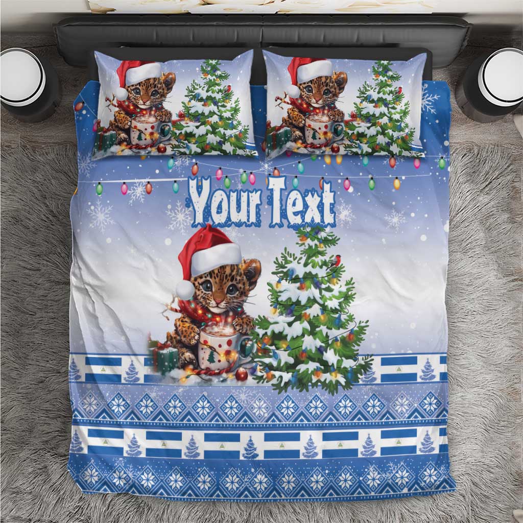 Blue Christmas bedding set with Santa-hat kitten, Christmas tree, ornaments, and patterned border