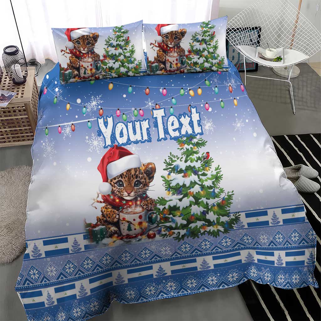 Blue Christmas duvet and pillowcases featuring a Santa-hat kitten, Christmas tree, and holiday patterns