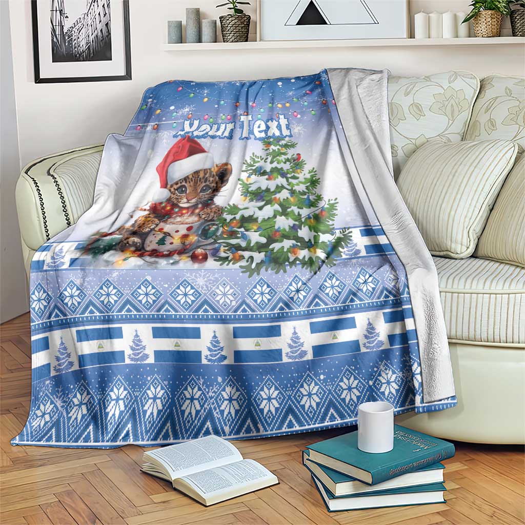 Blue Christmas blanket with “Your Text”, cute jaguar in Santa hat by Christmas tree