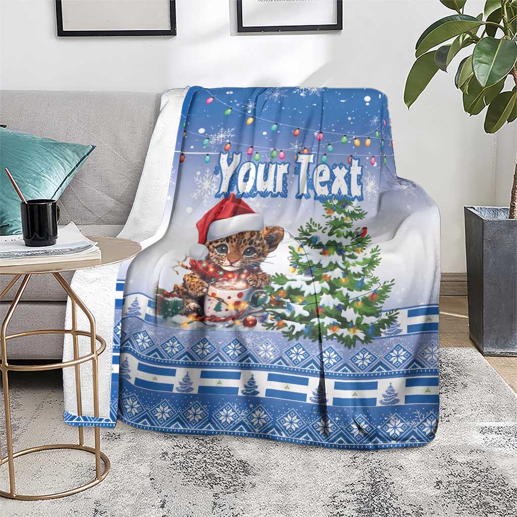 Blue Christmas blanket shown front-facing, “Your Text” with jaguar in Santa hat and tree