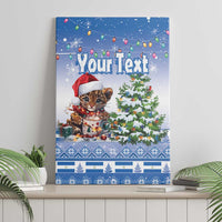 Blue canvas wall art showing a panther cub in a Santa hat, Christmas tree, and “Your Text”
