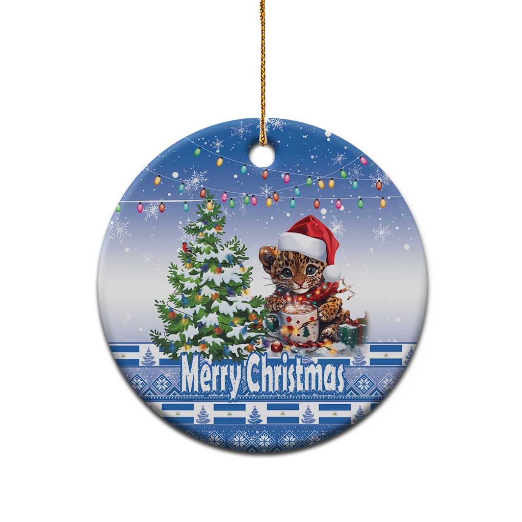 Blue round ceramic Christmas ornament with cat in Santa hat and “Merry Christmas”