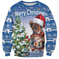 Unisex blue Christmas sweatshirt with cute panther cat, Santa hat, mug and tree graphic