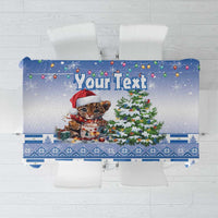 Blue Christmas tablecloth with cute panthera onca cat, Christmas tree and holiday icons