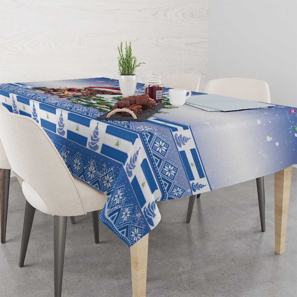 Blue Christmas tablecloth with geometric border pattern and cat with Christmas tree graphic