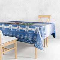 Blue Christmas tablecloth with repeating snowy pattern and central cat-and-tree illustration