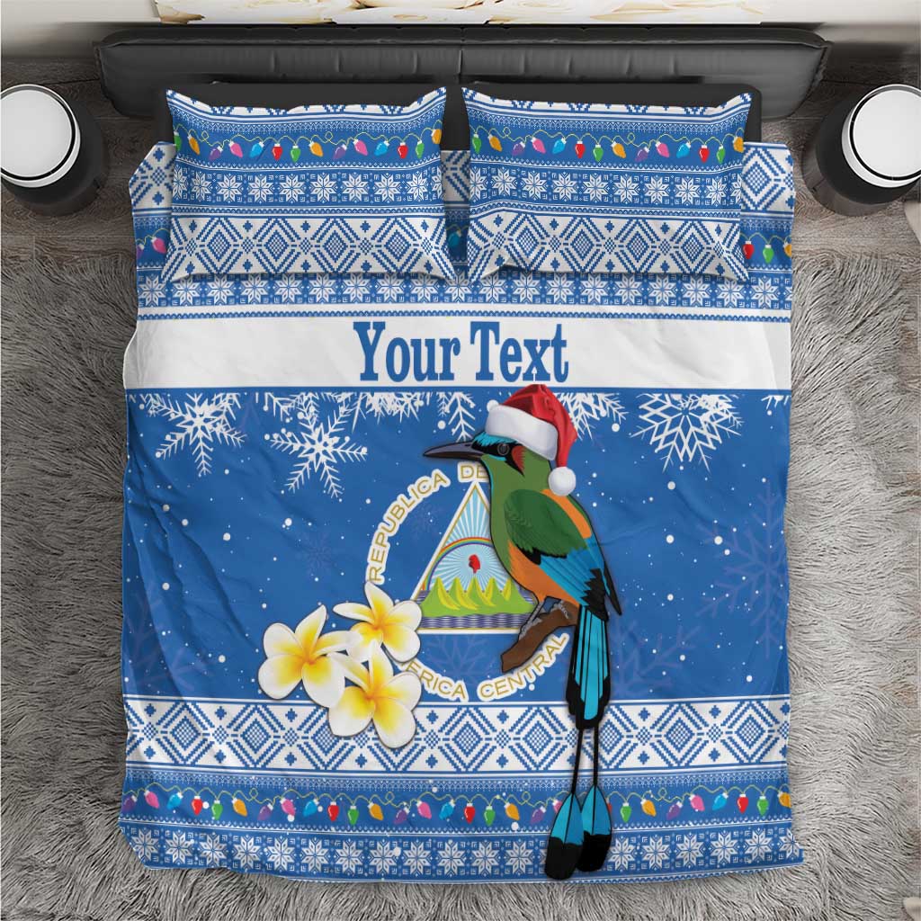 Blue Christmas bedding set top view with bird, snowflakes, floral accents, and pillowcases
