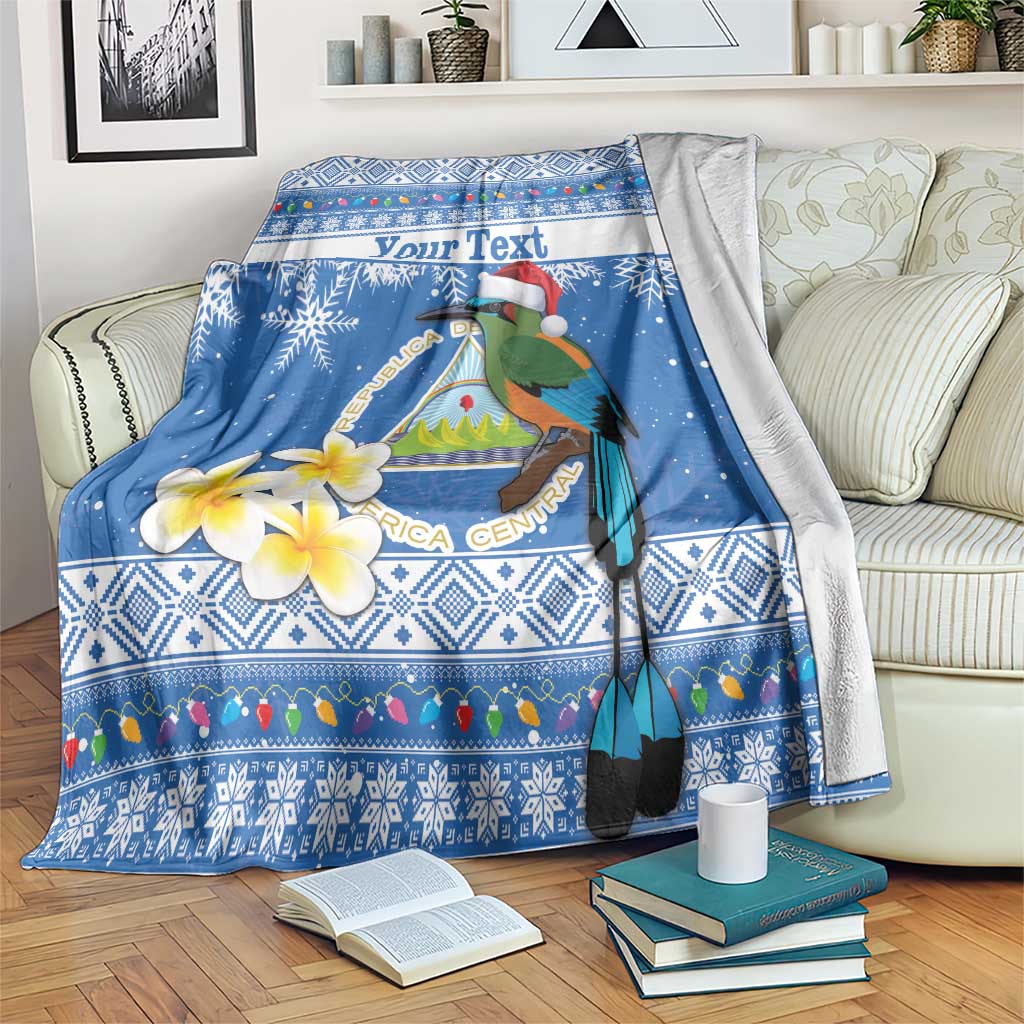 Blue Christmas blanket with colorful bird, tropical map graphic, and 'Your Text'