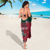 Red and green rugby-themed sarong with center wolf mascot, '00' and 'YOUR TEXT'