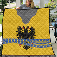 Yellow, gray, and blue knight-themed quilt with black double-headed eagle emblem