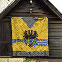 Yellow and gray knight quilt with blue stripe, black eagle crest, and red accents