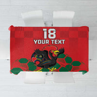 Red football-themed tablecloth with rooster mascot and green hex pattern, custom text area.