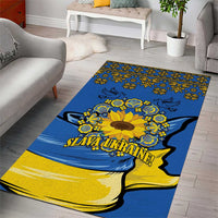 Blue rug with yellow sunflower florals, Ukraine silhouette, and 'Slava Ukraine' lettering