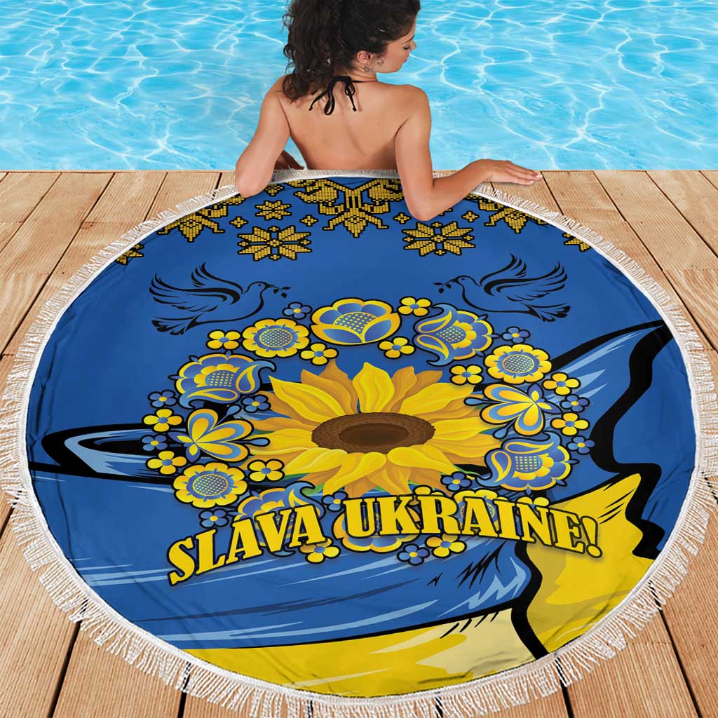 Round blue beach blanket with yellow sunflower folk artwork and tassel edge