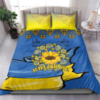 Blue and yellow bedding set with yellow pillowcases and sunflower emblem with folk patterns