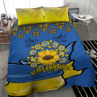 Blue duvet cover with yellow accents, sunflower peace sign emblem, and matching pillowcases