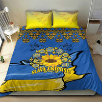 Blue and yellow duvet cover and pillowcases featuring sunflower peace sign and folk motifs