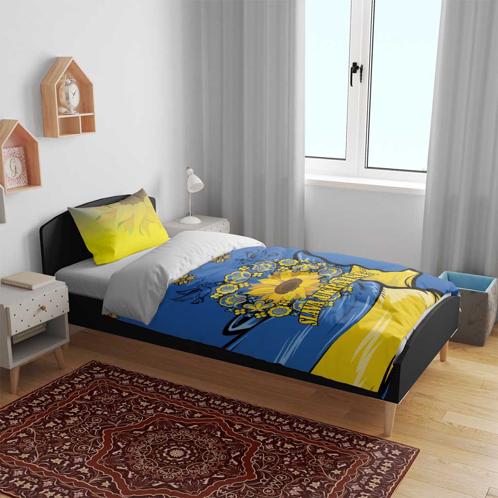 Blue duvet cover on a bed with yellow pillowcases, sunflower peace sign and folk design