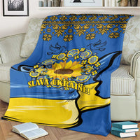 Blue and yellow sunflower folk blanket with ornate border and “SLAVA UKRAINE!”