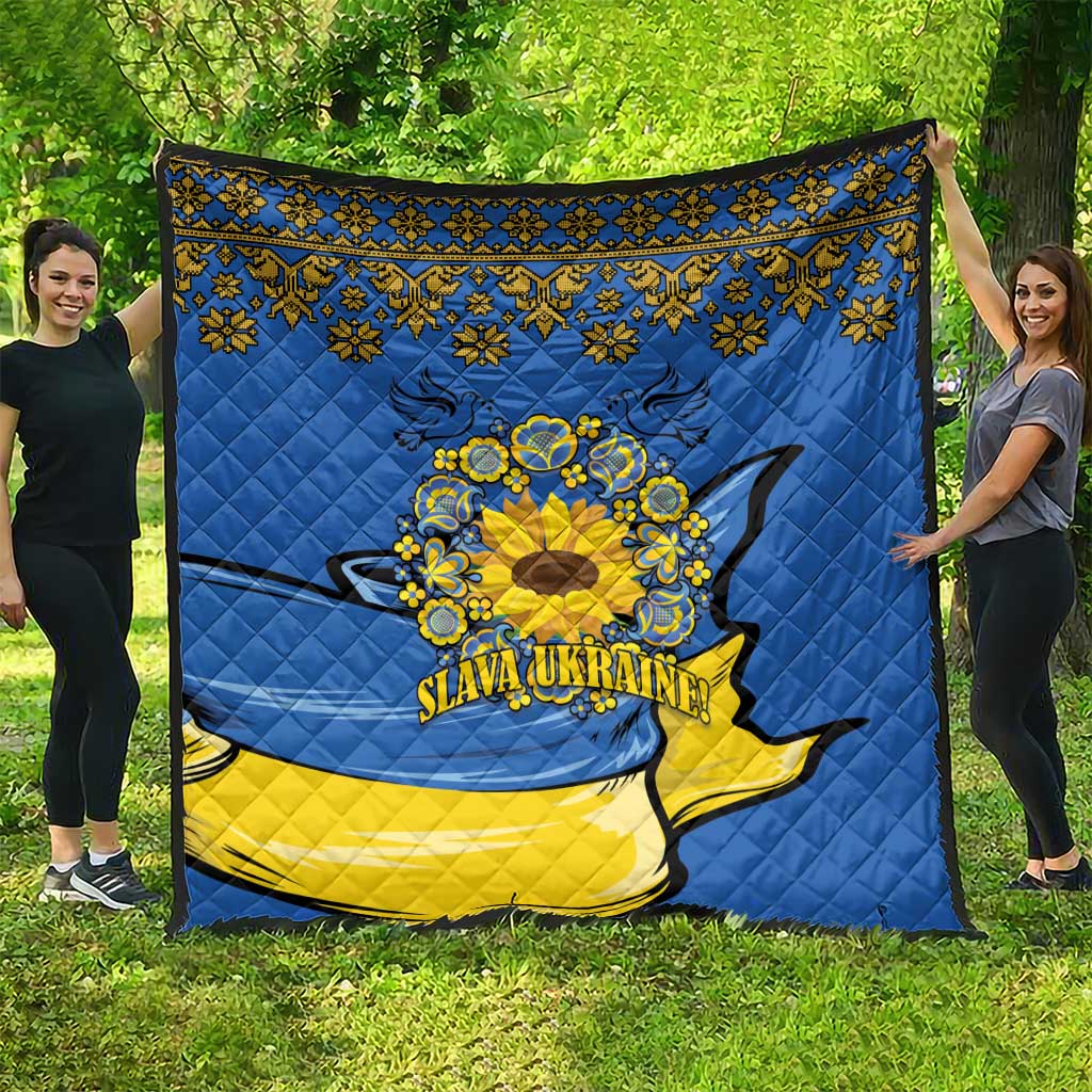 Blue quilt with yellow hem band, folk trim, sunflower peace sign, dove graphic