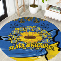 Round blue rug with yellow sunflower, folk motifs, and “SLAVA UKRAINE” text