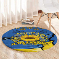 Round blue rug with yellow sunflower and “SLAVA UKRAINE” text along the bottom