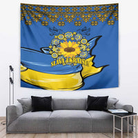 Blue wall tapestry with yellow sunflower wreath and "Slava Ukraine!" banner text